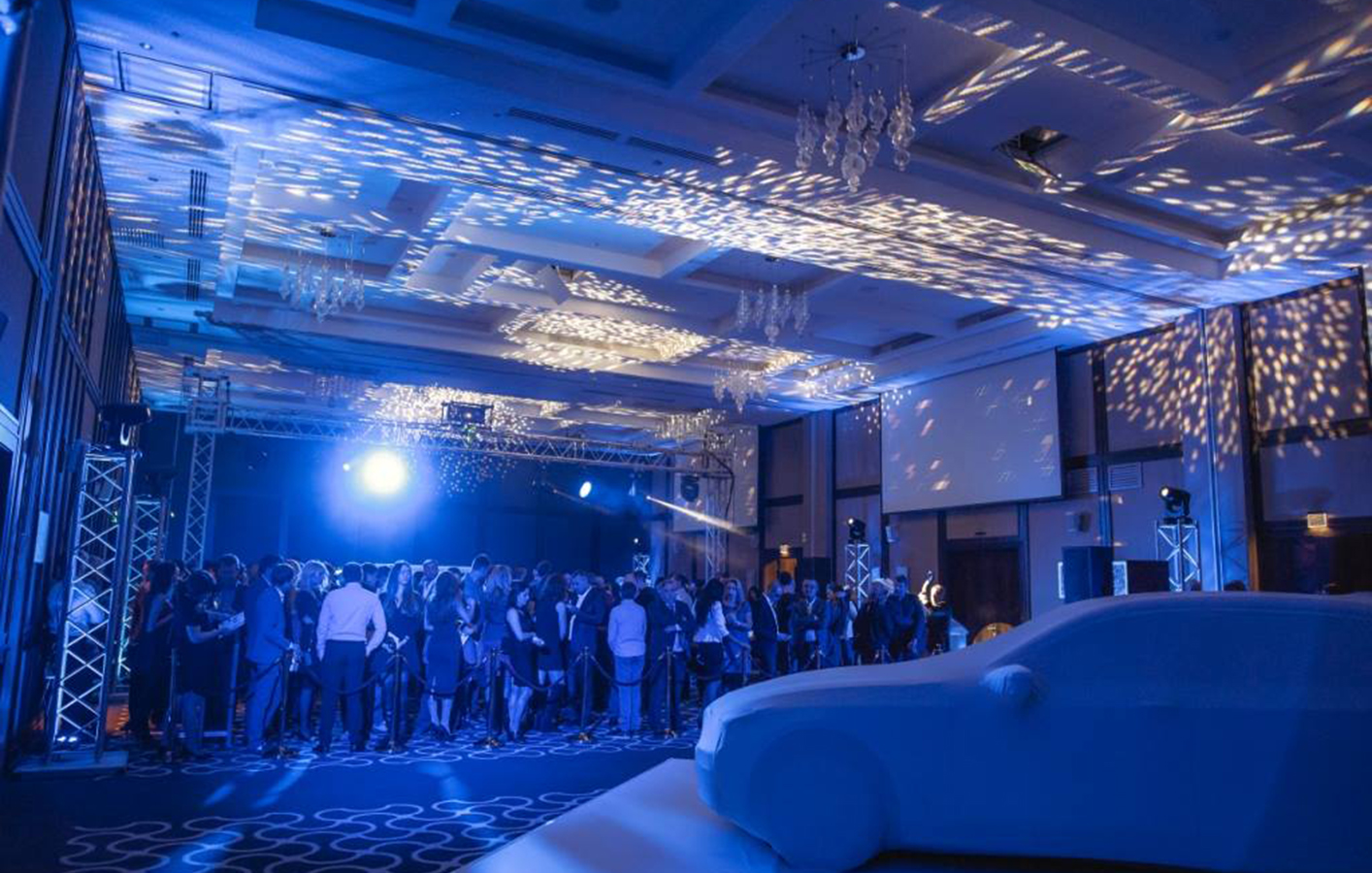 Crowd gathering in space for launch of new BMW car