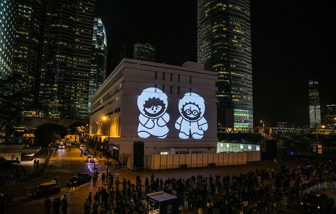 Building in Hong Kong with two cartoon charters projected on side