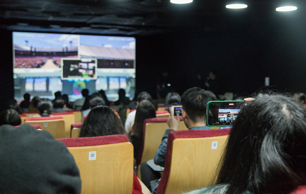 People filming talk