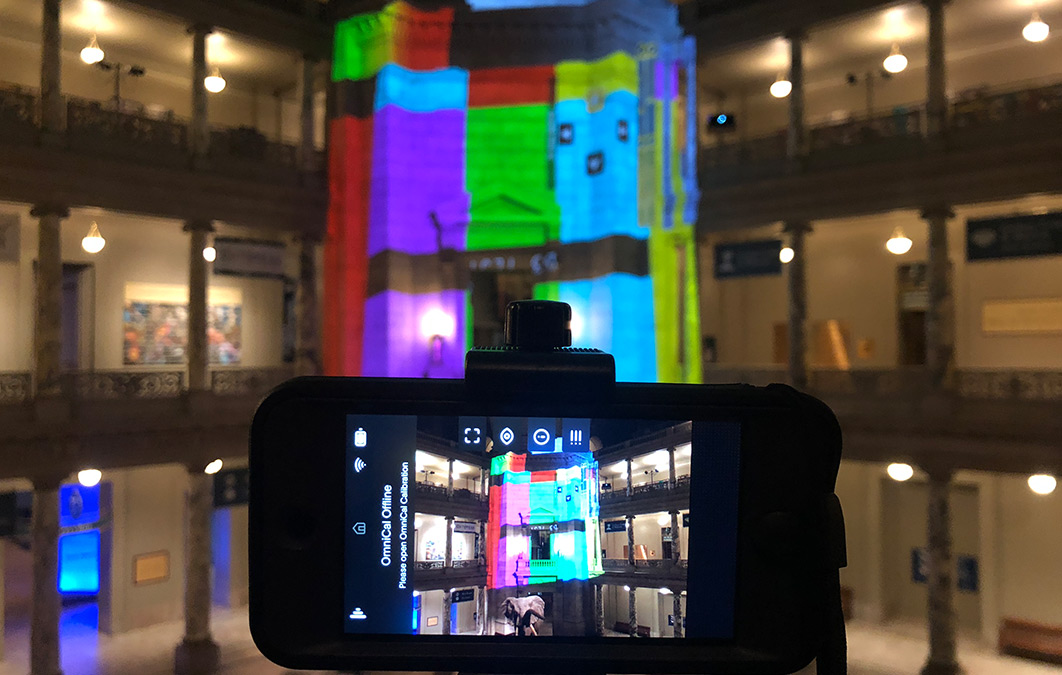 Camera viewing projection mapping exercise in building interior