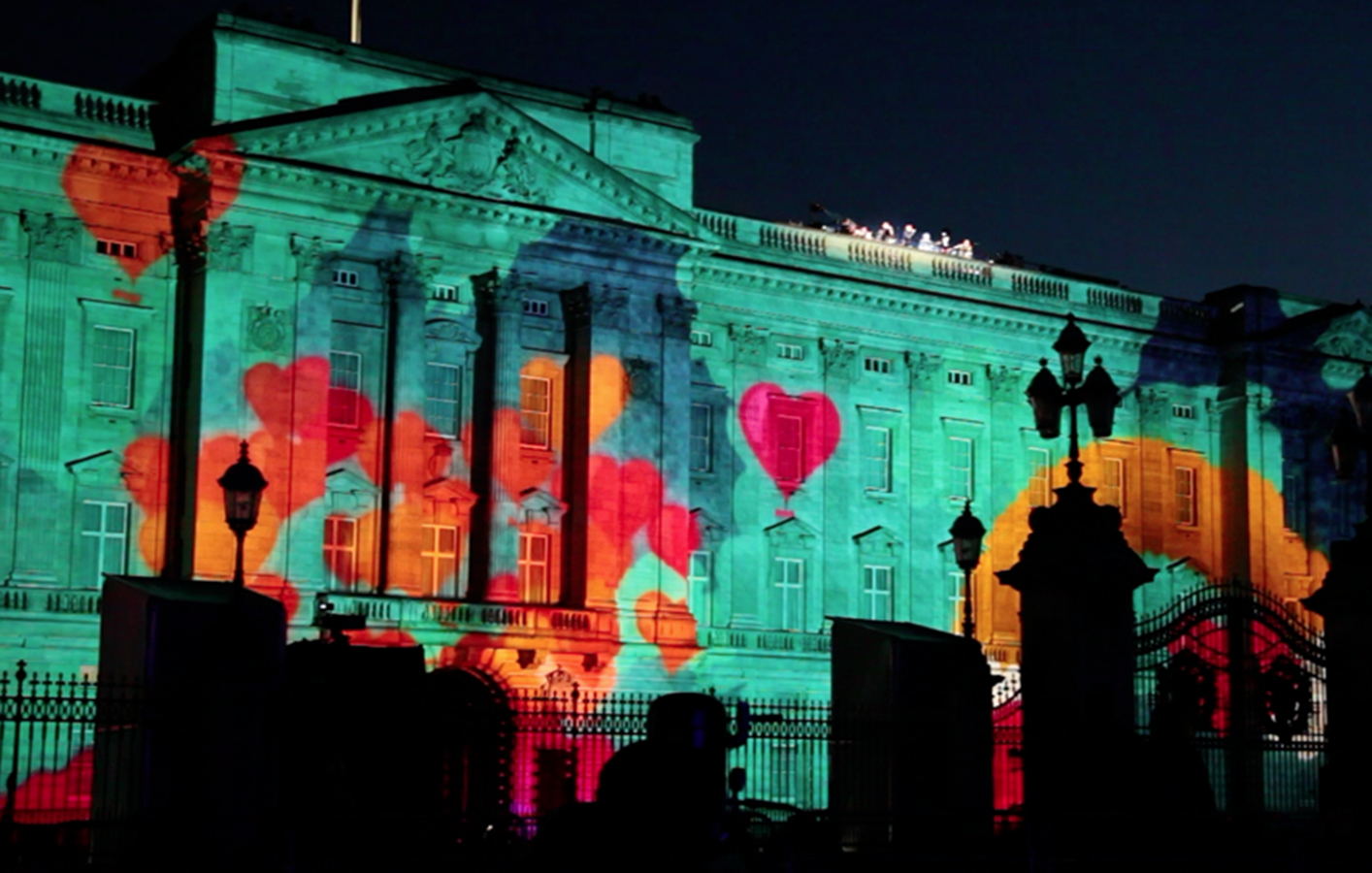 Multiple hearts projected on Buckingham Palace