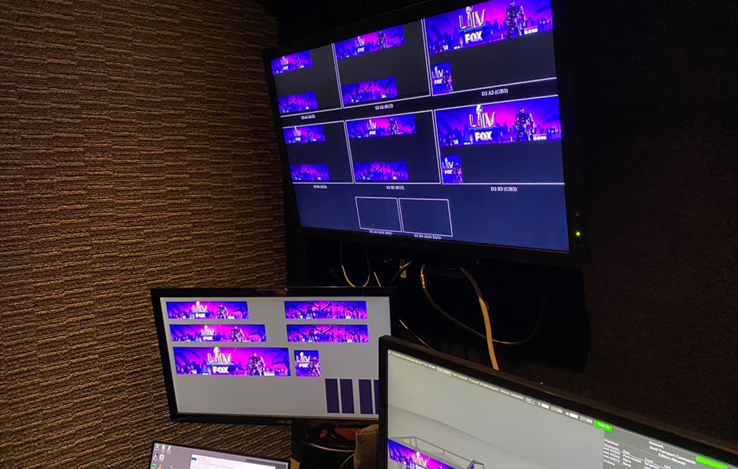 Computer screens displaying creative assets for NFL coverage