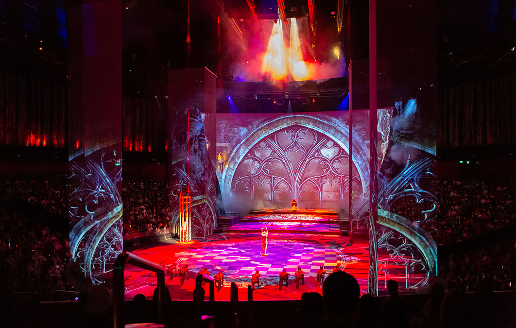 Performer stands in the middle of stage