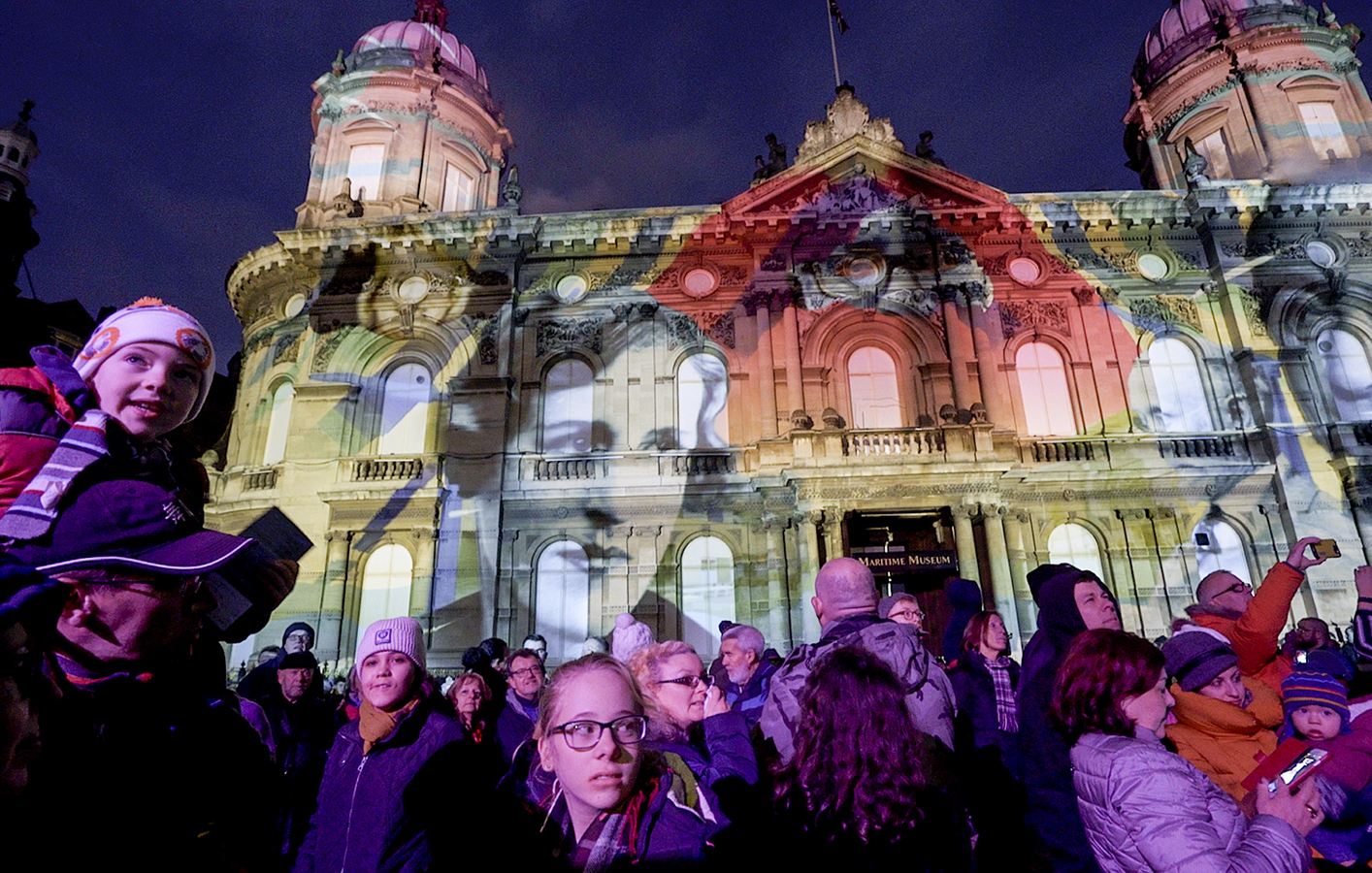 Crowd watching projection mapping experience