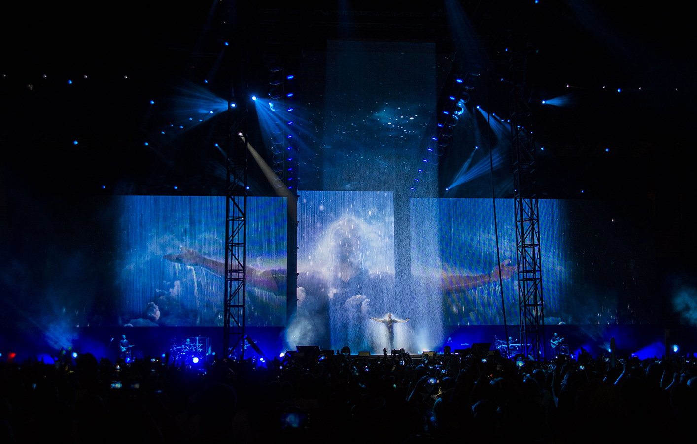 Rain fall effect falls on Tiziano Ferro as he performs on stage