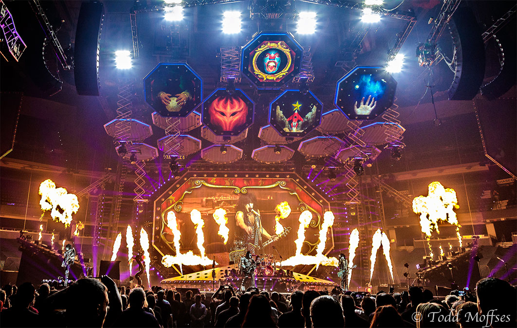 Paul Stanley seen on screen for live performance surrounded by jets of fire
