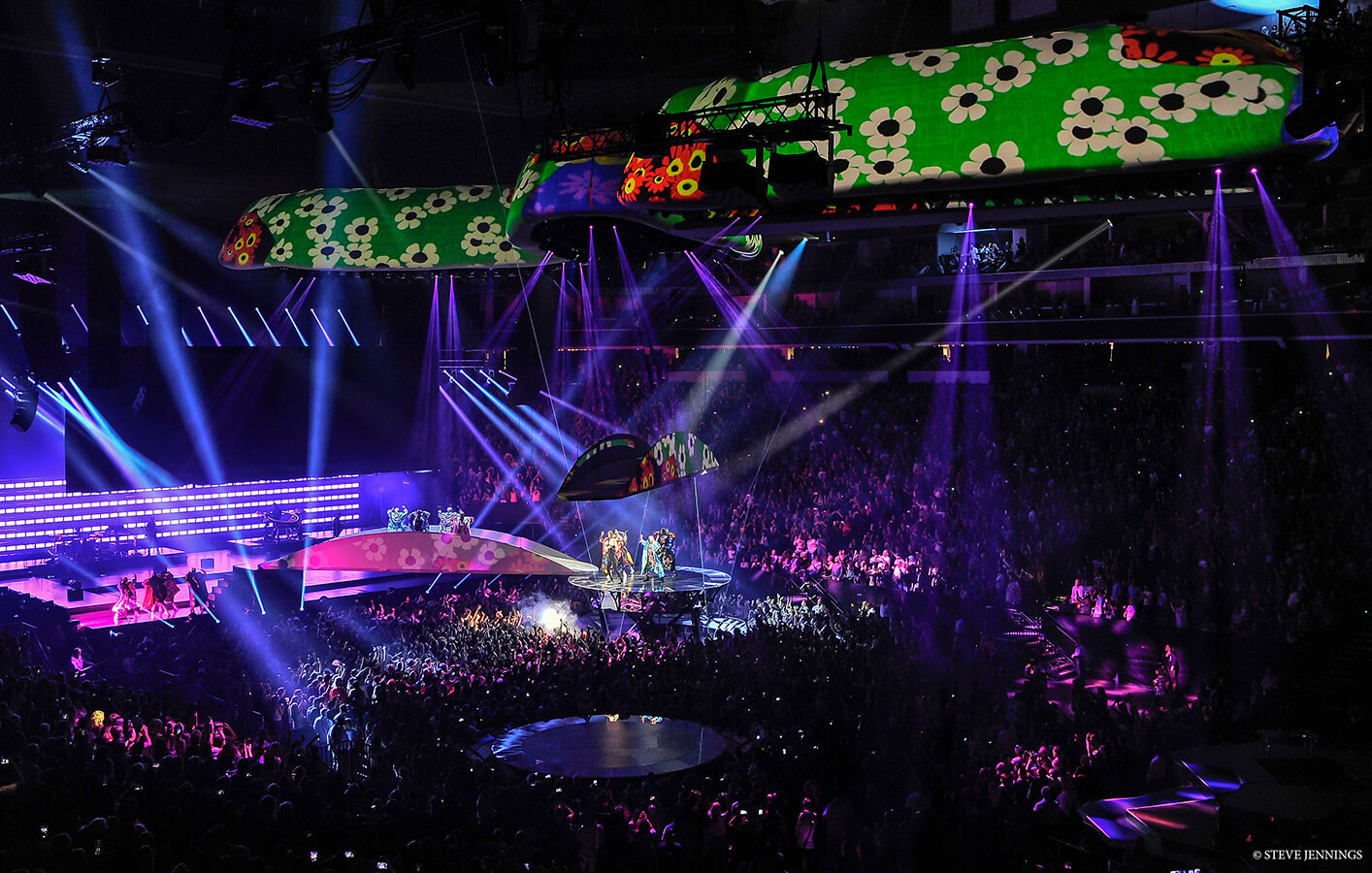 Lady Gaga and performers on plinth in crowd