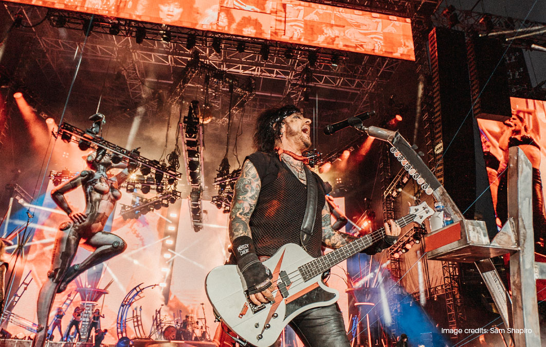 Nikki Sixx of Motley Crus playing on stage