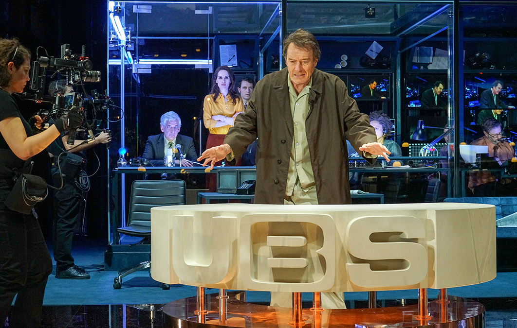 Bryan Cranston performing as news anchor on broadway theatre production