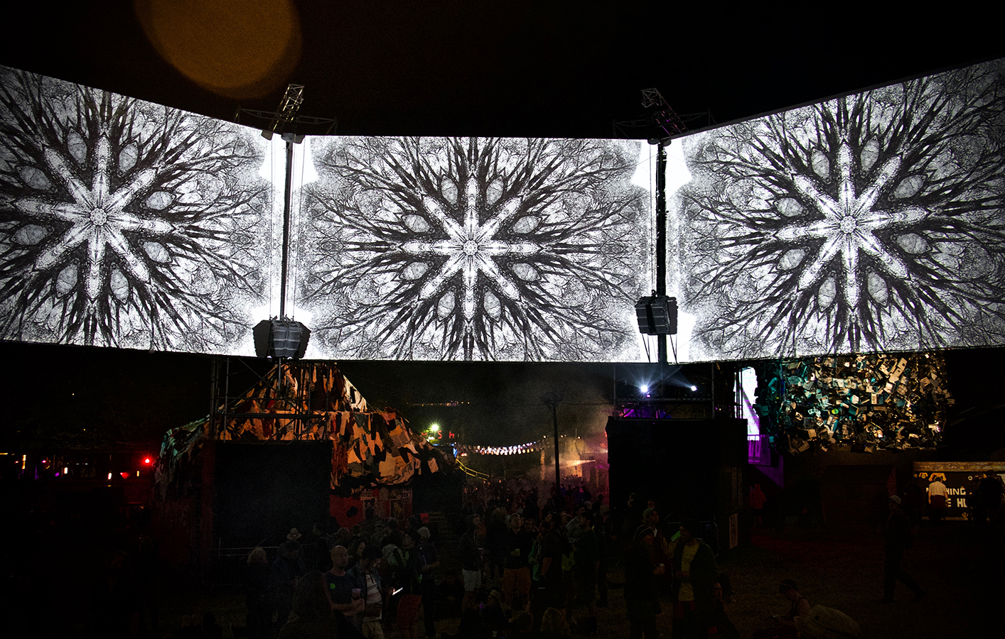 Black and white patten shown across three LED screens