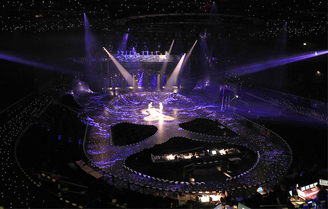 Multiple lights shine on actors during starlight express performance