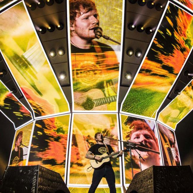 Ed Sheeran playing in front of multiple LED screens