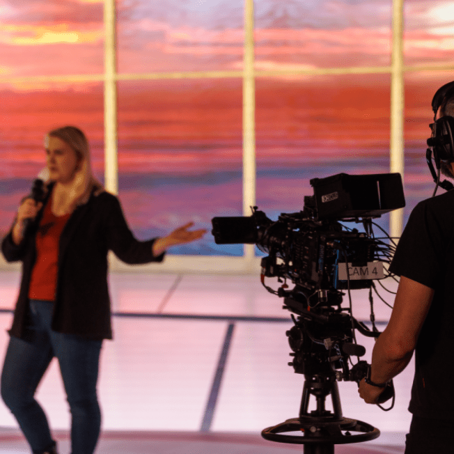 Talent on stage being filmed