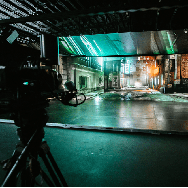 A dark alleyway being displayed on an LED Volume