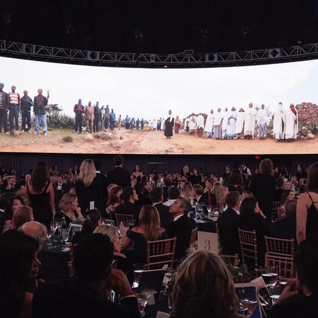 Large group of people at charity fundraiser dinner 