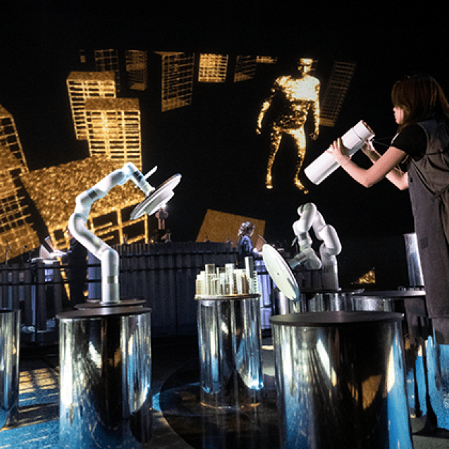 Women interacting with props for Keep Breathing at Zero