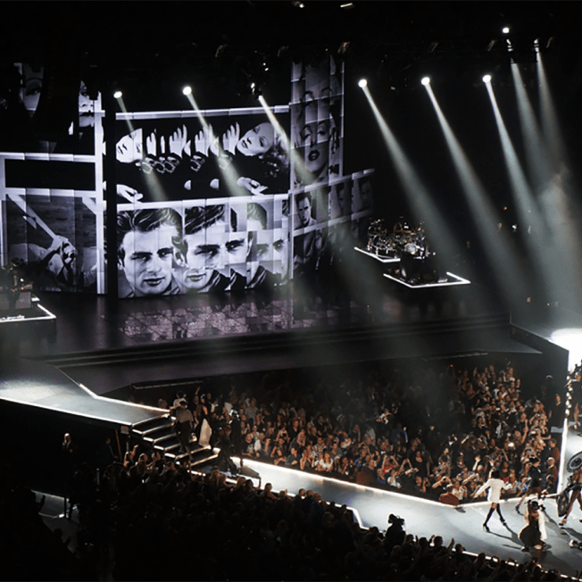 Stage for Madonna featuring screens featuring photos of James Dean and Madonna