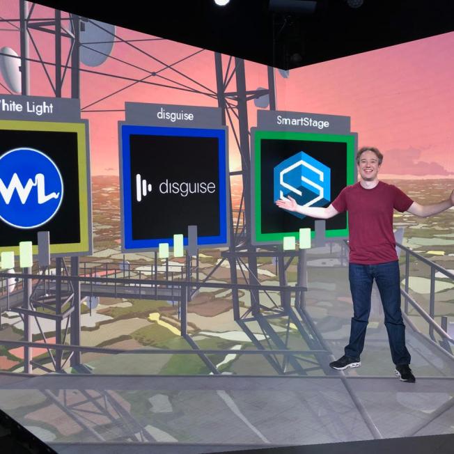 Man presenting on virtual stage for press release