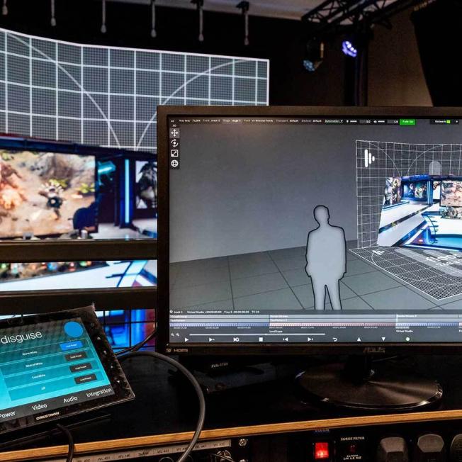 multiple computer screens showing Disguise products being used