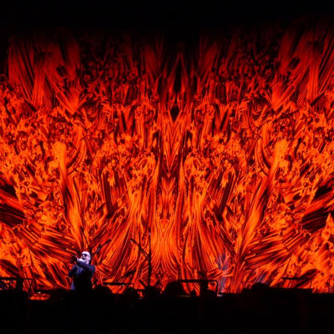 George Michael performs in front of LED display with red flaming video effect
