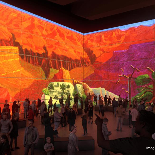 crowd of people viewing a David Hockney visual display at the Lightroom immersive experience