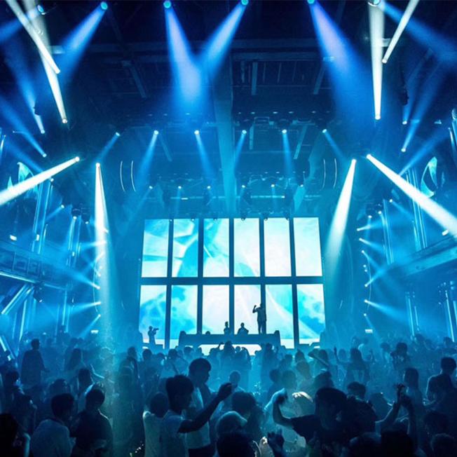 DJ act performing in front of led stage