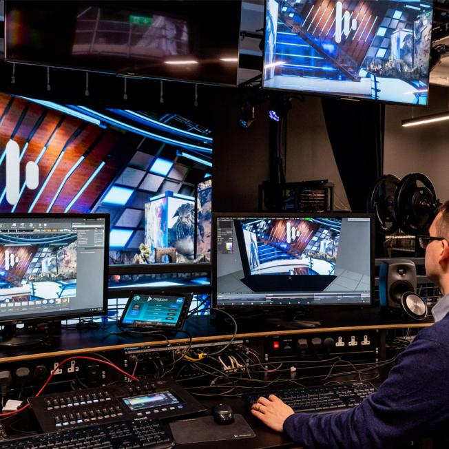 Man working on Designer for xR stage displays
