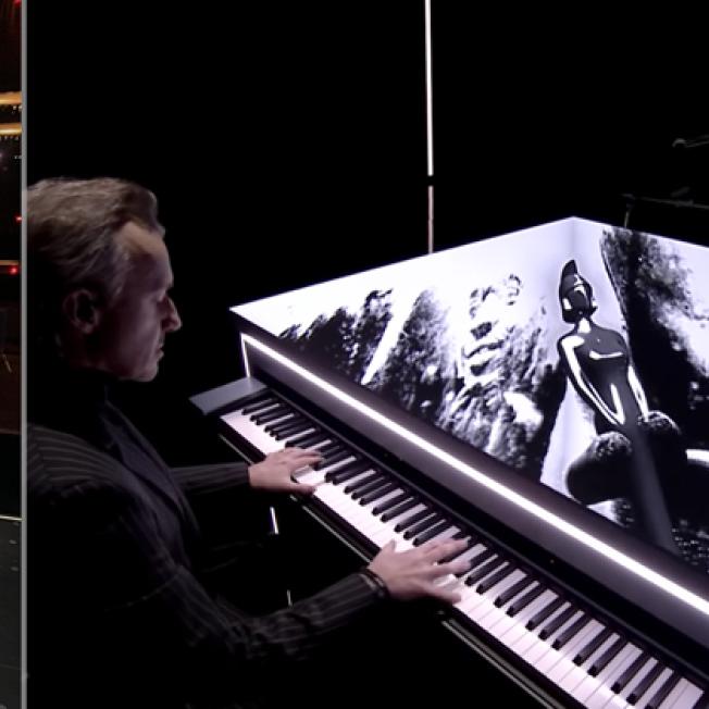Man performing on piano on stage