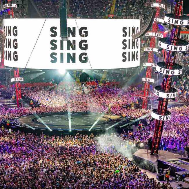 Wide view of Ed Sheeran performing in stadium