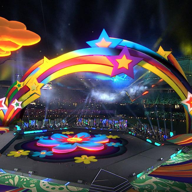 Stage design featuring colourful flowers and shooting stars