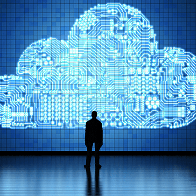 Man stands in front of cloud illustration on LED screen
