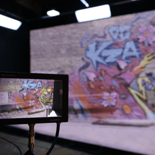 Wall of graffiti viewed through a preview screen