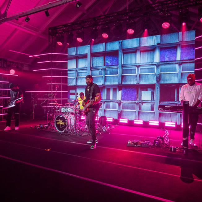 Four band members playing live