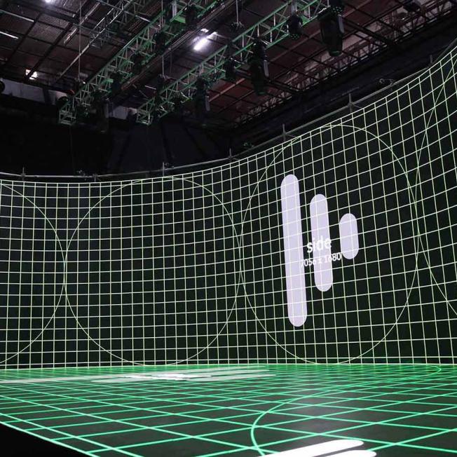 virtual production stage with Disguise loading display