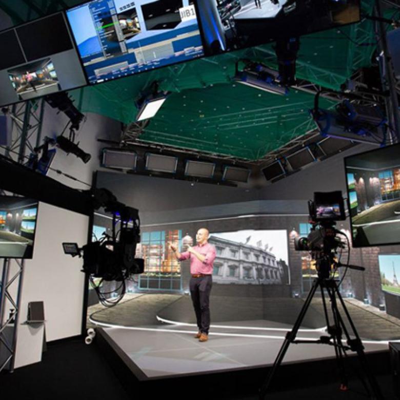Man presenting on xr stage in front of cameras