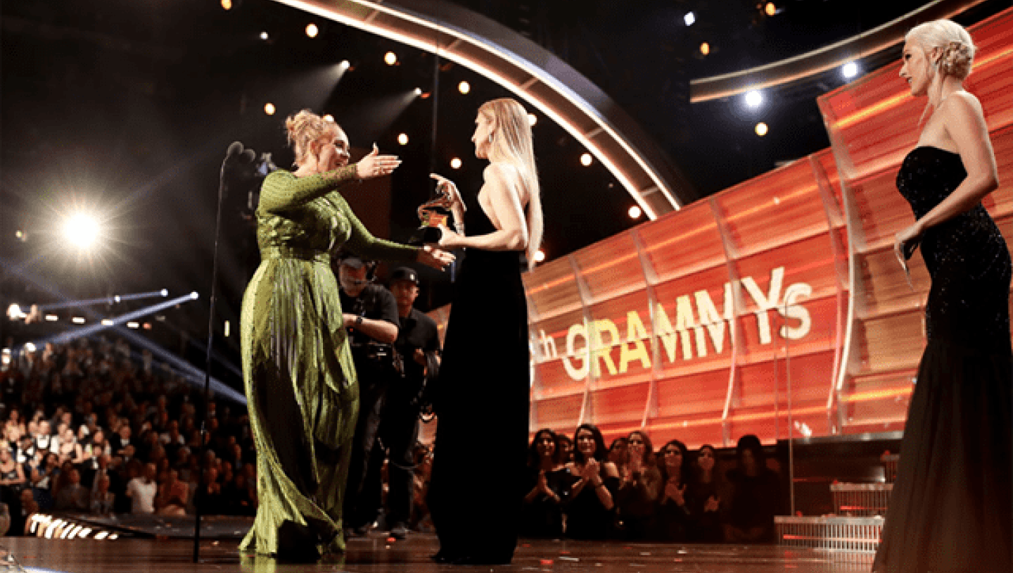 Adele embracing host at Grammys