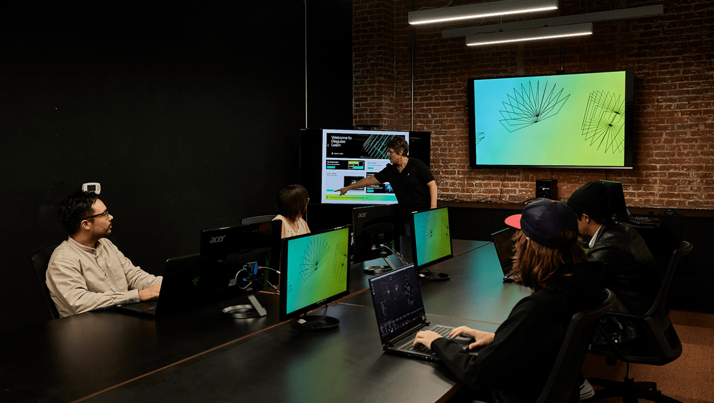 Group of students in meeting space for Disguise tutorial