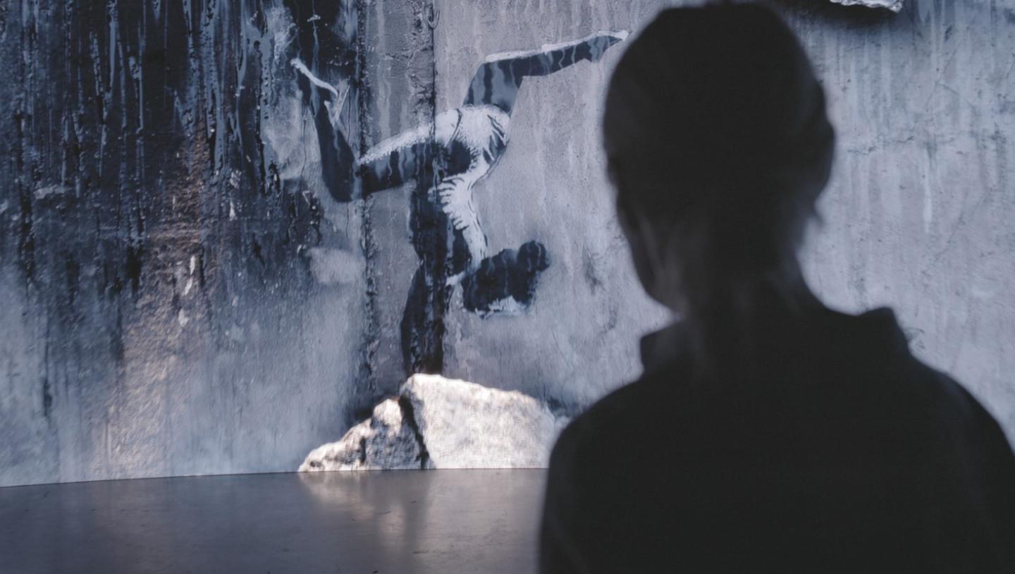 Person looking at mural