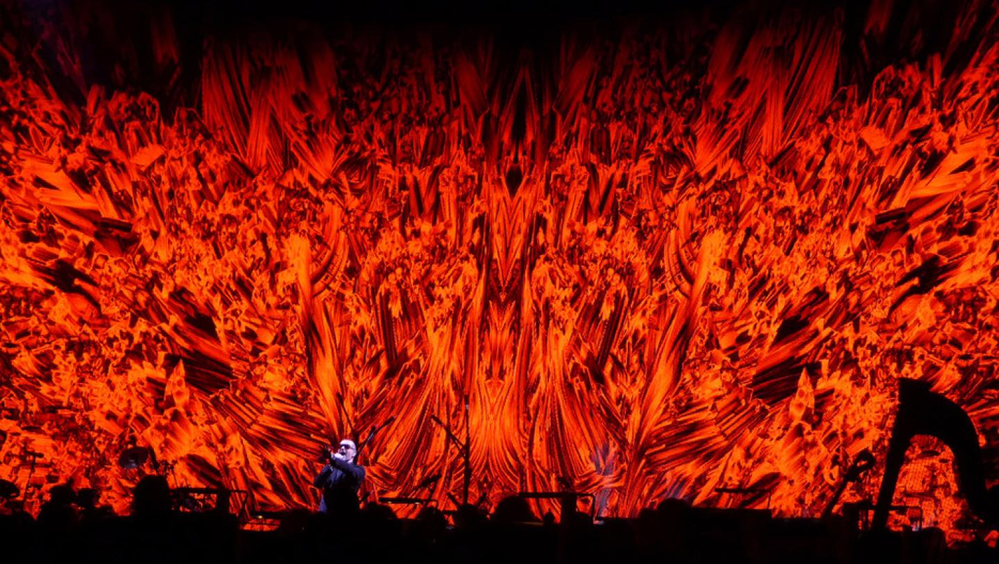 George Michael performs in front of LED display with red flaming video effect
