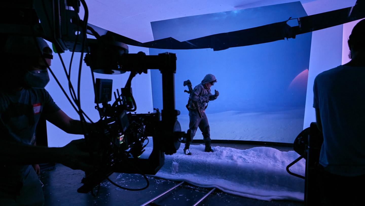 Man walking in snow suit on VP stage